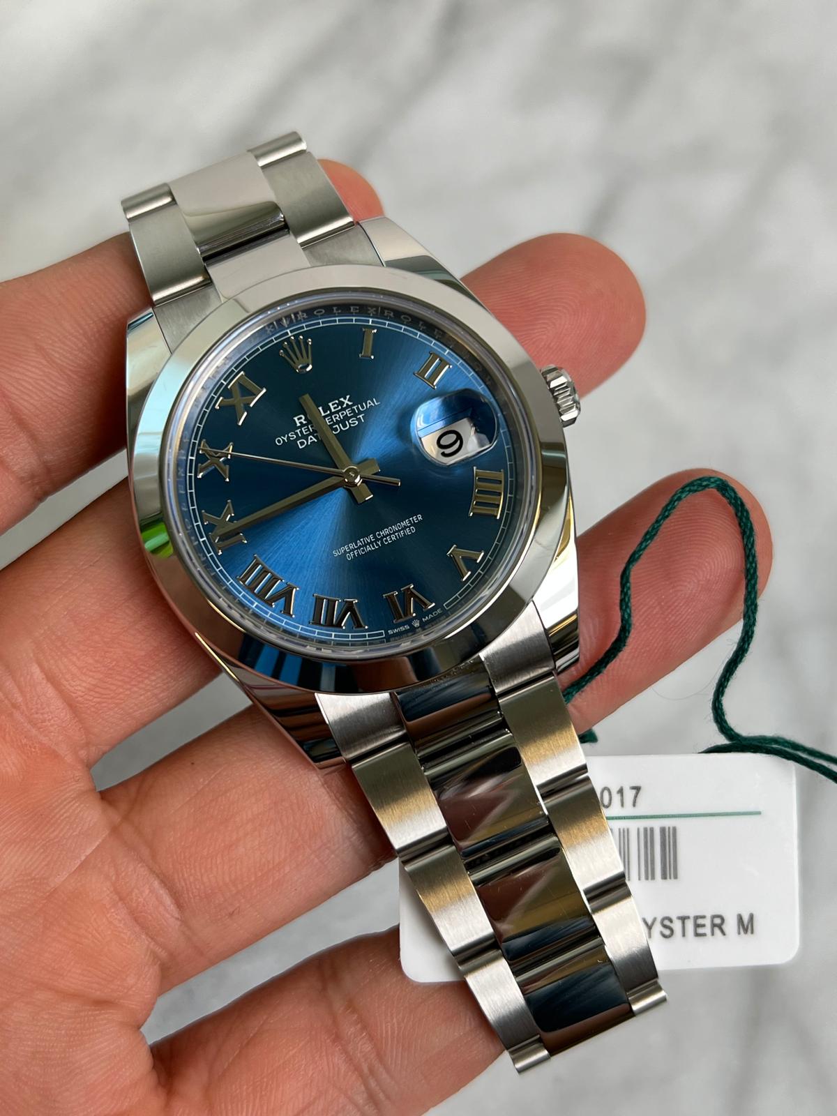 2024 126300 Oyster Blue Roman Preowned Good Complete w/ White Tag